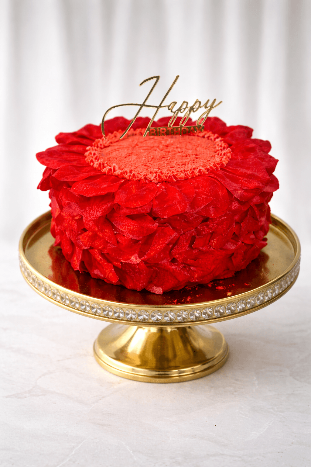 Red wafer paper petal cake with Happy Birthday topper